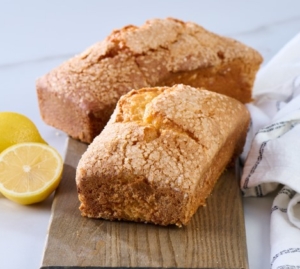 Baked whole loaf cakes on rustic wooden background